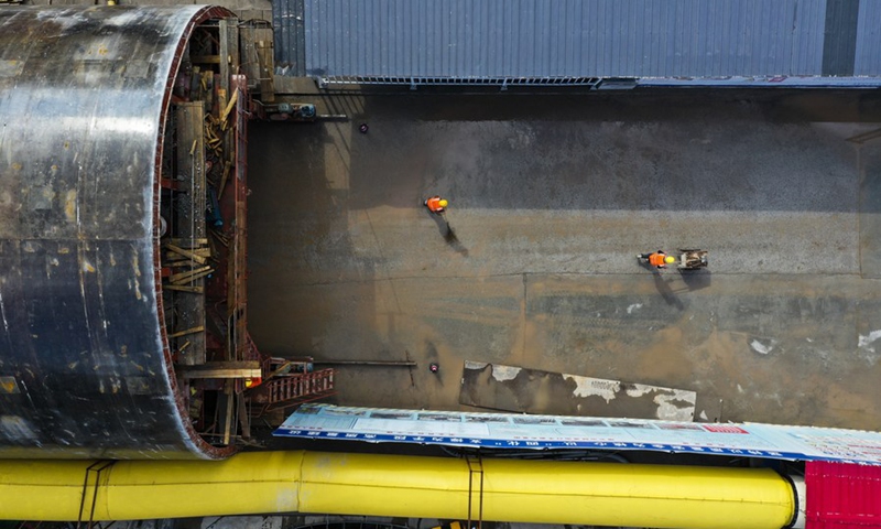 Aerial photo taken on Feb. 9, 2022 shows staff members working outside a tunnel of a high-speed railway project in southwest China's Chongqing Municipality.(Photo: Xinhua)