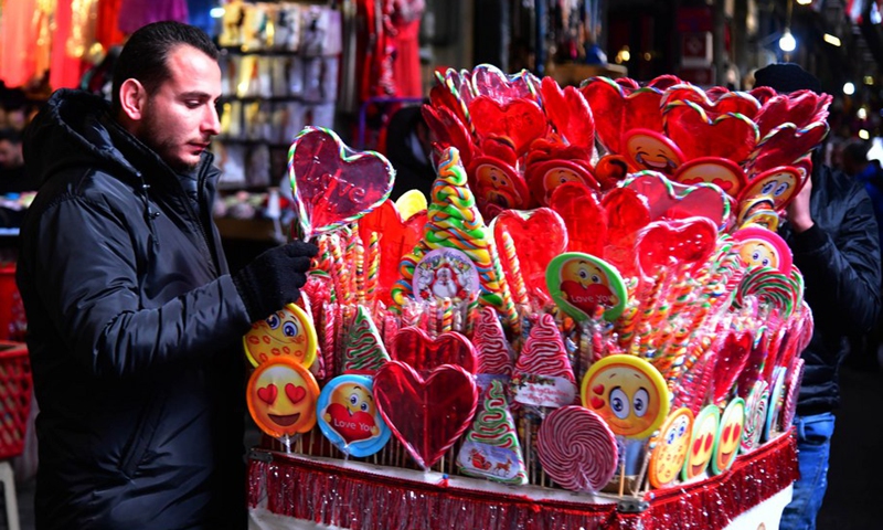 Photo taken on Feb. 10, 2022 shows a Syrian shopkeeper preparing gifts for the upcoming Valentine's Day in the capital Damascus.(Photo: Xinhua)