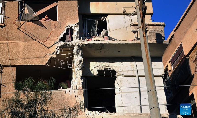 A damaged building is seen in the Qudsaya suburb of Damascus, capital of Syria, Feb. 9, 2022, as a result of the Israeli strikes that targeted military sites in Damascus earlier on Wednesday.(Photo: Xinhua)