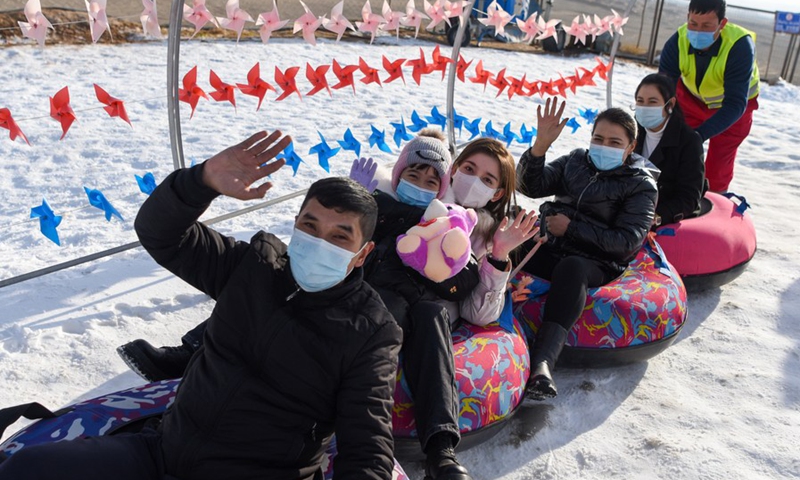 Tourists play on snow tubes at Oynak ski resort in Moyu County, northwest China's Xinjiang Uygur Autonomous Region, Jan. 9, 2022. (Photo: Xinhua)