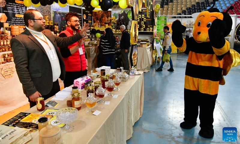 People visit the Honey Festival in Damascus, capital of Syria, Feb. 20, 2022.Photo:Xinhua