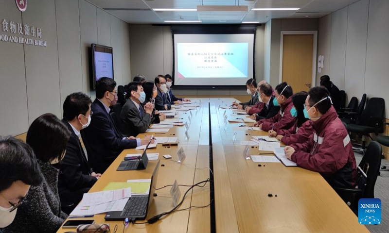 The team of the mainland epidemiological experts exchange views with representatives from the Food and Health Bureau of the Hong Kong Special Administrative Region (HKSAR) government, in south China's Hong Kong, Feb. 20, 2022.Photo:Xinhua