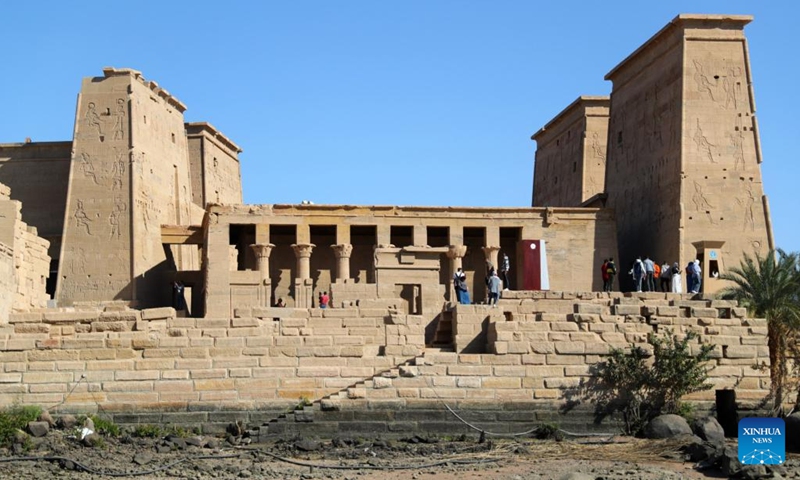 Tourists visit the Philae temple complex in Aswan, Egypt, on Feb. 21, 2022. The Philae temple complex, one of the most popular tourist destinations in Aswan, is entering tourist season.(Photo: Xinhua)