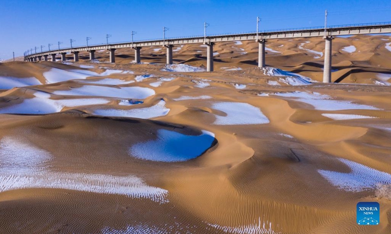 Photo taken on Feb, 21, 2022 shows the snow view in the desert of Aksay Kazakh Autonomous County, Jiuquan, northwest China's Gansu Province.(Photo: Xinhua)