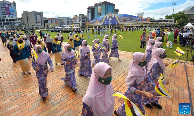 People join a parade during Brunei's National Day celebrations in Bandar Seri Begawan, capital of Brunei, on Feb. 23, 2022.(Photo: Xinhua)