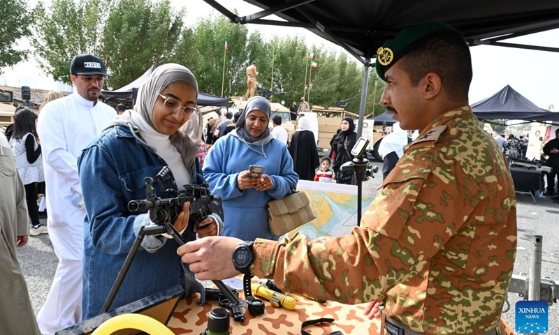 People visit a military show during celebrations of Kuwait's National and Liberation Days in Kuwait City, Kuwait, on Feb. 25, 2022. Celebrations were held on Friday to mark Kuwait's National and Liberation Days, which are observed annually on Feb. 25 and Feb. 26.(Photo: Xinhua)