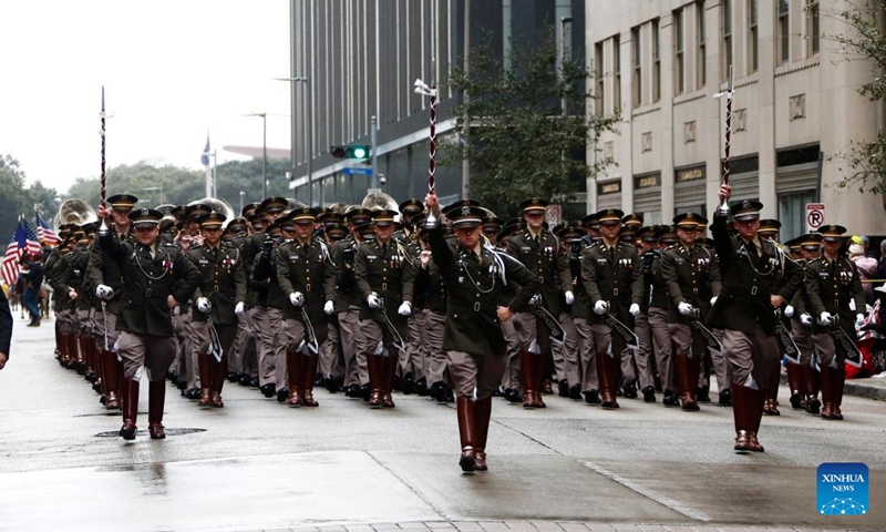 A military band marches during the 90th Downtown Rodeo Parade in Houston, Texas, the United States, Feb. 26, 2022. (Photo by Lao Chengyue/Xinhua)