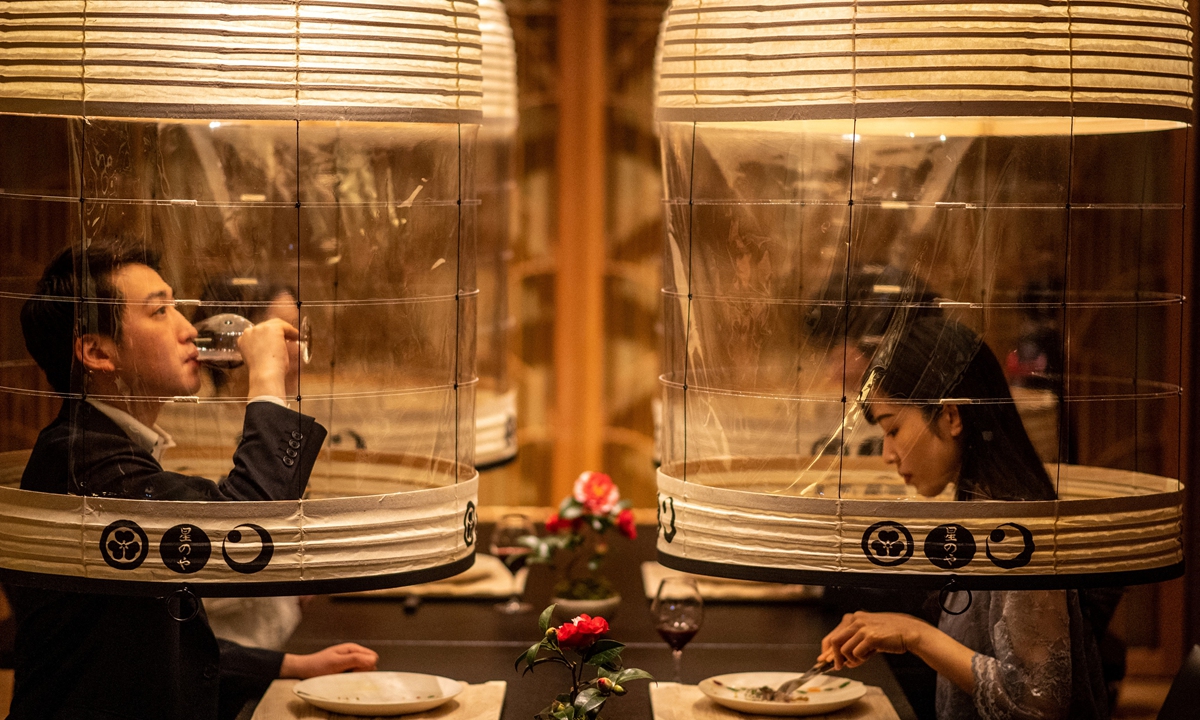 Staff members from the Hoshinoya Tokyo hotel demonstrate the 