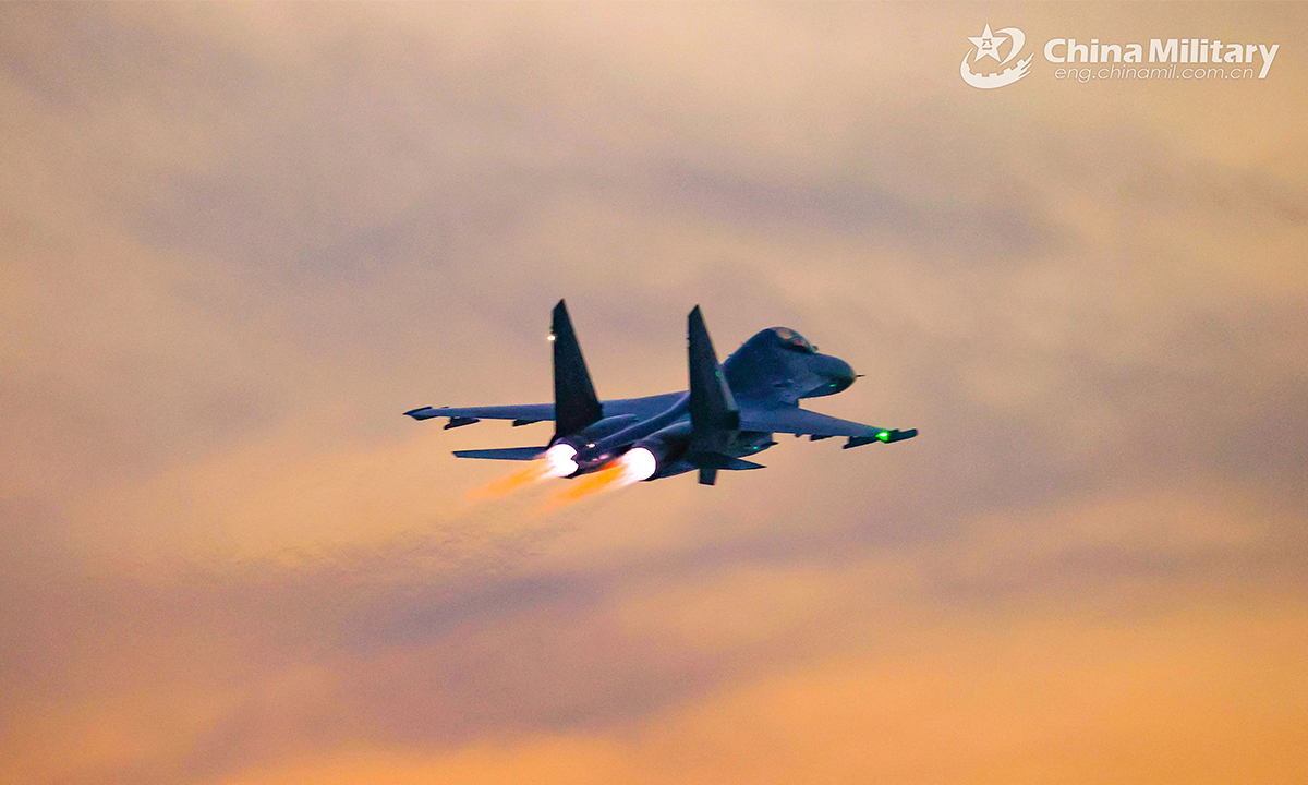 A fighter jet attached to an aviation brigade under the PLA Air Force soars in the sky during a round-the-clock training exercise on February 20, 2022. (eng.chinamil.com.cn/Photo by Cui Baoliang)