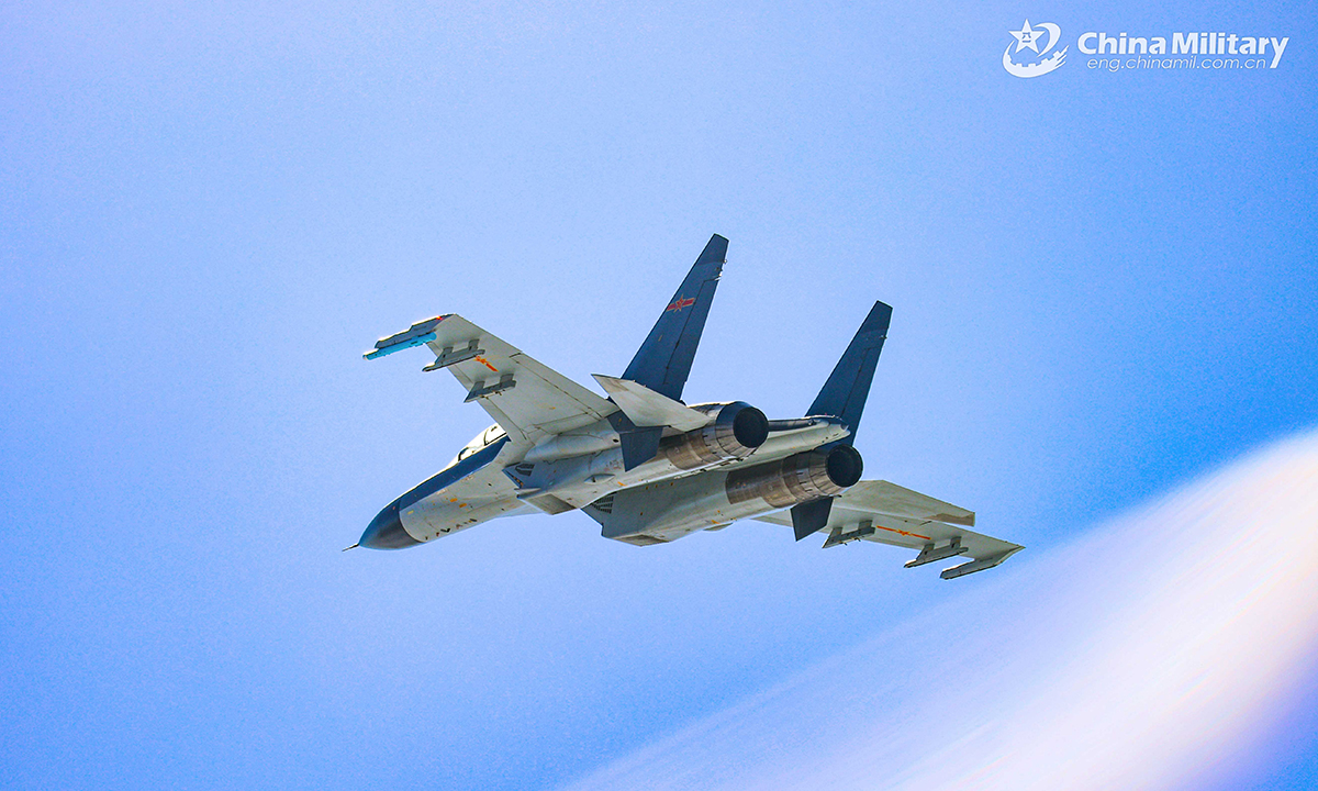 A fighter jet attached to an aviation brigade under the PLA Air Force soars in the sky during a round-the-clock training exercise on February 20, 2022. (eng.chinamil.com.cn/Photo by Cui Baoliang)