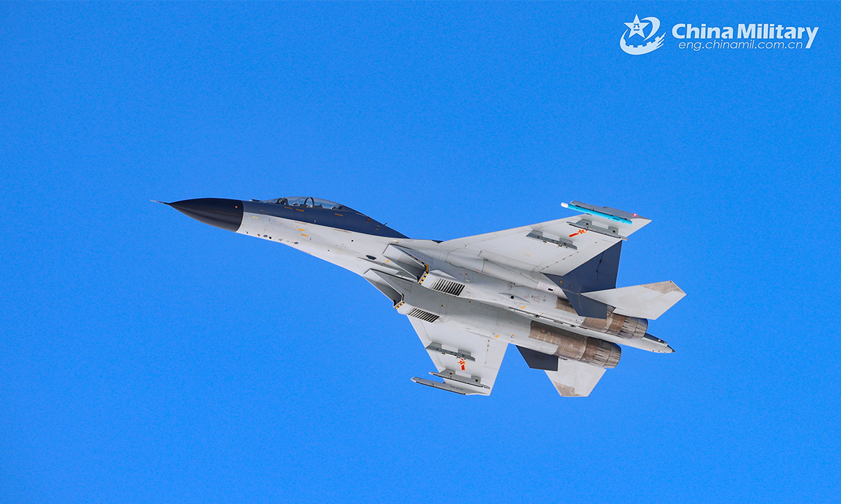 A fighter jet attached to an aviation brigade under the PLA Air Force soars in the sky during a round-the-clock training exercise on February 20, 2022. (eng.chinamil.com.cn/Photo by Cui Baoliang) 