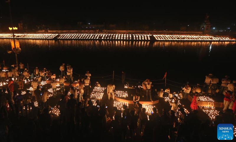 Devotees light earthen lamps on the banks of the Kshipra River on the occasion of Hindu festival Mahashivratri in Ujjain area, Madhya Pradesh state, India, on March 1, 2022.Photo:Xinhua