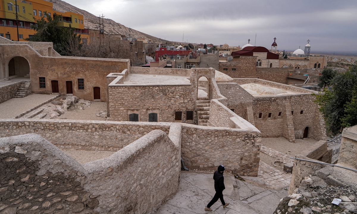 A man walks outside the Prophet Nahum synagogue in Iraq's northern town of al-Qosh on February 3, 2022. Photo: AFP