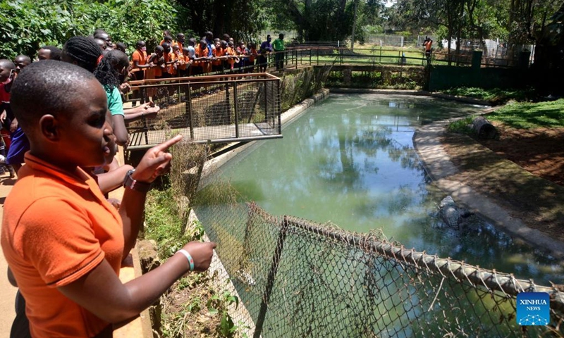 Children visit a crocodile sanctuary during the World Wildlife Day celebrations at Uganda Wildlife Conservation Education Center in Entebbe, Uganda, on March 3, 2022.(Photo: Xinhua)