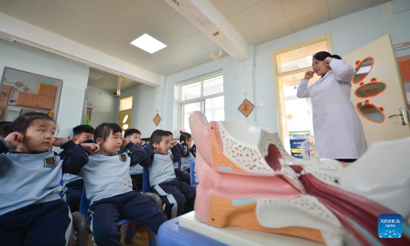 Children learn ear-protecting tips at a kindergarten in Handan, north China's Hebei Province, March 2, 2022. March 3 marks China's national Ear Care Day. Various activities were held to promote public awareness of hearing protection.(Photo: Xinhua)