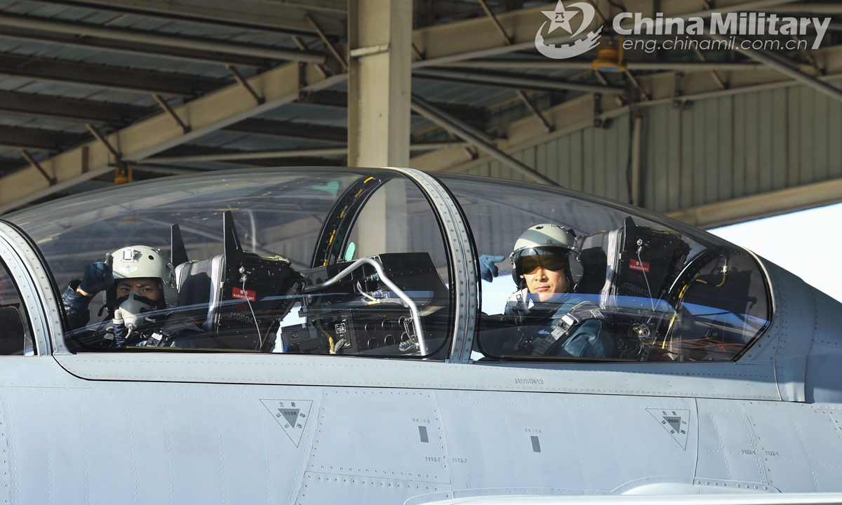 Pilots assigned to an aviation brigade of the air force under the PLA Central Theater Command get ready for takeoff during a round-the-clock combat flight training exercise on February 23, 2022.Photo:China Military