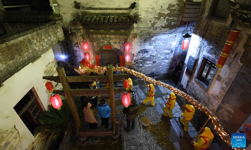 Villagers perform dragon dance with the straw-woven dragon to greet the Longtaitou Day in Shuyuan Village, Huizhou District of Huangshan, east China's Anhui Province, March 2, 2022.Photo:Xinhua