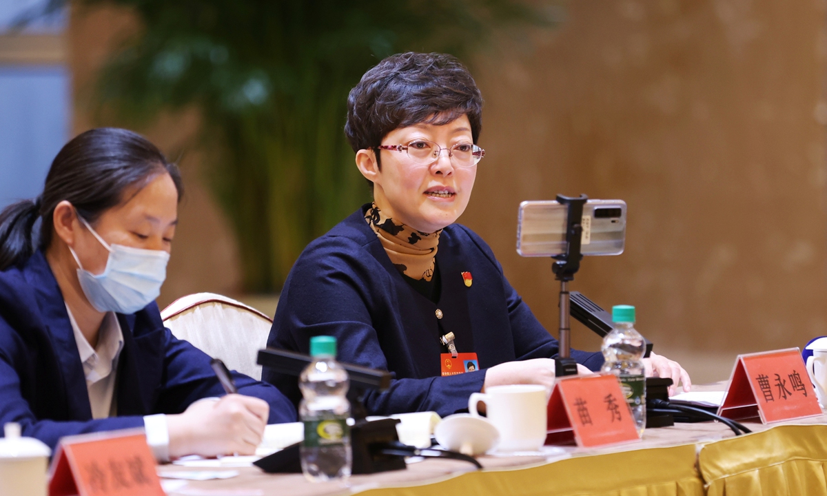 Cao Yongming (right), a deputy to the National People's Congress from Northeast China's Heilongjiang Province, makes a proposal on education on March 6, 2022 during the provincial delegation's panel discussion. Photo: VCG