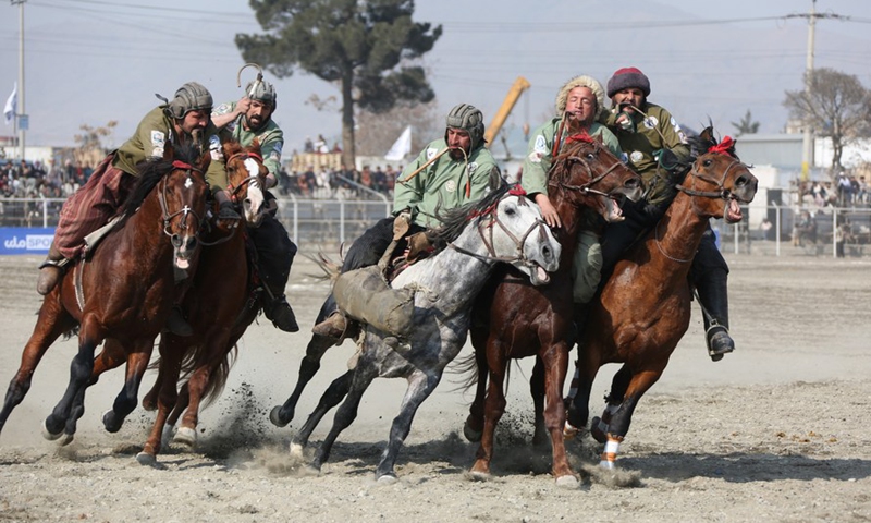 Horse riders compete during a game of Buzkashi in Kabul, capital of Afghanistan, Feb. 27, 2022.Photo:Xinhua