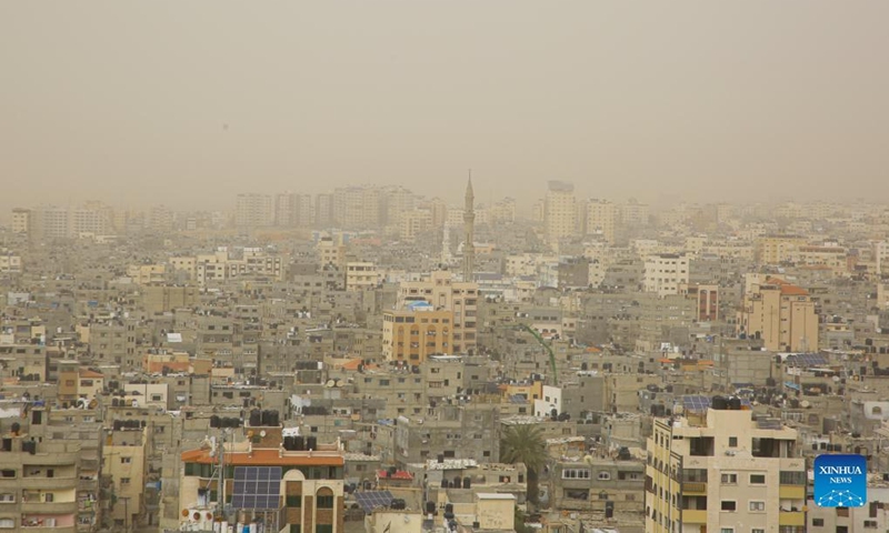 Photo taken on March 6, 2022 shows a view of Gaza City in a dust storm. (Photo by Rizek Abdeljawad/Xinhua)