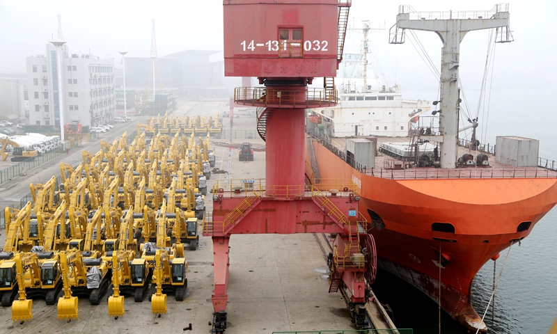 A ro-ro ship, berthed at Lianyungang, East China's Jiangsu Province, is ready to load excavators for export, on March 13, 2022. More than 600 excavators and other types of construction machinery were assembled at the port of Lianyungang, waiting to be shipped to Russia, Indonesia and other countries. In February, China exported 7,431 excavators, up 97.7 percent year-on-year, an industry report showed. Photo: VCG