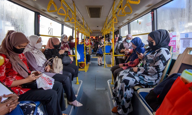 Women wearing face masks take a ladies' coach at a bus station in Kuala Lumpur, Malaysia, March 7, 2022.(Photo: Xinhua)