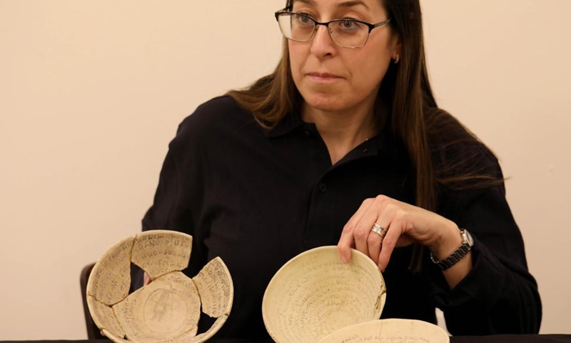 Ancient magical bowls are shown in Jerusalem, on March 7, 2022. Ancient magical bowls, carrying spells and incantations scripts in the Hebrew and Babylonian-Aramaic languages, were uncovered in Jerusalem, the Israel Antiquities Authority (IAA) said on Monday.(Photo: Xinhua)