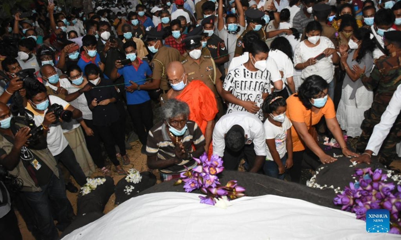 People mourn the death of the ceremonial tusker Nadungamuwa Raja in Gampaha, Sri Lanka, on March 7, 2022. Sri Lankan citizens on Monday mourned the death of the famous ceremonial tusker Nadungamuwa Raja, which died in the early hours of the day following a brief illness. The elephant was in its sixties at the time of its death.(Photo: Xinhua)