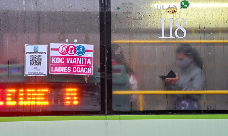 Women wearing face masks take a ladies' coach at a bus station in Kuala Lumpur, Malaysia, March 7, 2022.(Photo: Xinhua)