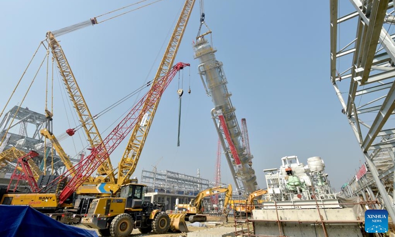 A carbon dioxide stripper tower is installed at a fertilizer plant under construction in Narsingdi, Bangladesh, on March 8, 2022. The carbon dioxide stripping tower, the first super-heavy equipment of Bangladesh's Ghorashal-Polash Urea fertilizer project (GPUFP), the country's largest and first ever green fertilizer factory, was installed successfully on Tuesday.(Photo: Xinhua)