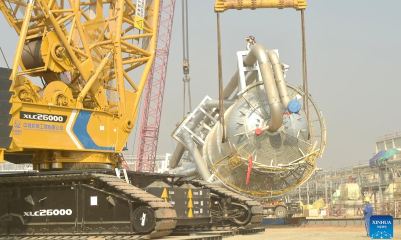 A carbon dioxide stripper tower is installed at a fertilizer plant under construction in Narsingdi, Bangladesh, on March 8, 2022. The carbon dioxide stripping tower, the first super-heavy equipment of Bangladesh's Ghorashal-Polash Urea fertilizer project (GPUFP), the country's largest and first ever green fertilizer factory, was installed successfully on Tuesday.(Photo: Xinhua)