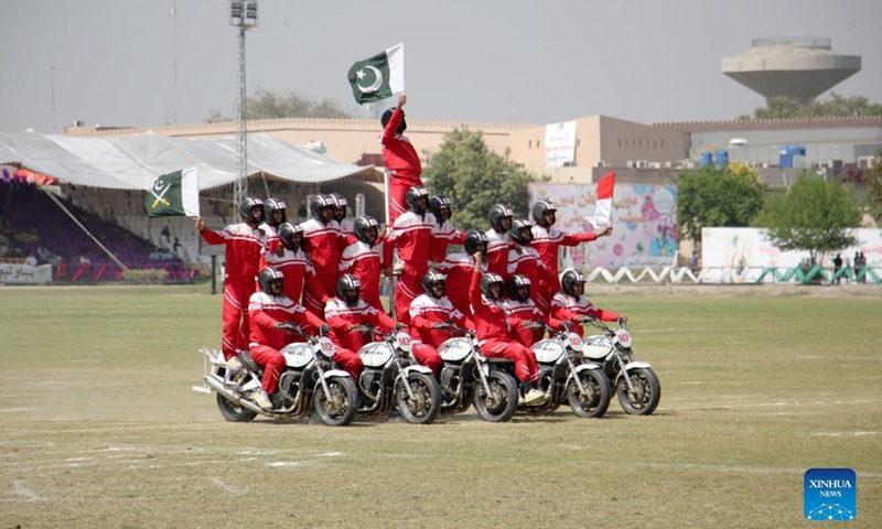 Pakistanis perform during a horse and cattle show in Lahore, Pakistan on March 11, 2022.Photo:Xinhua