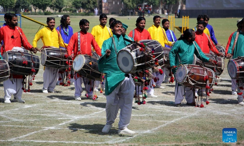 Pakistanis perform during a horse and cattle show in Lahore, Pakistan on March 11, 2022.Photo:Xinhua