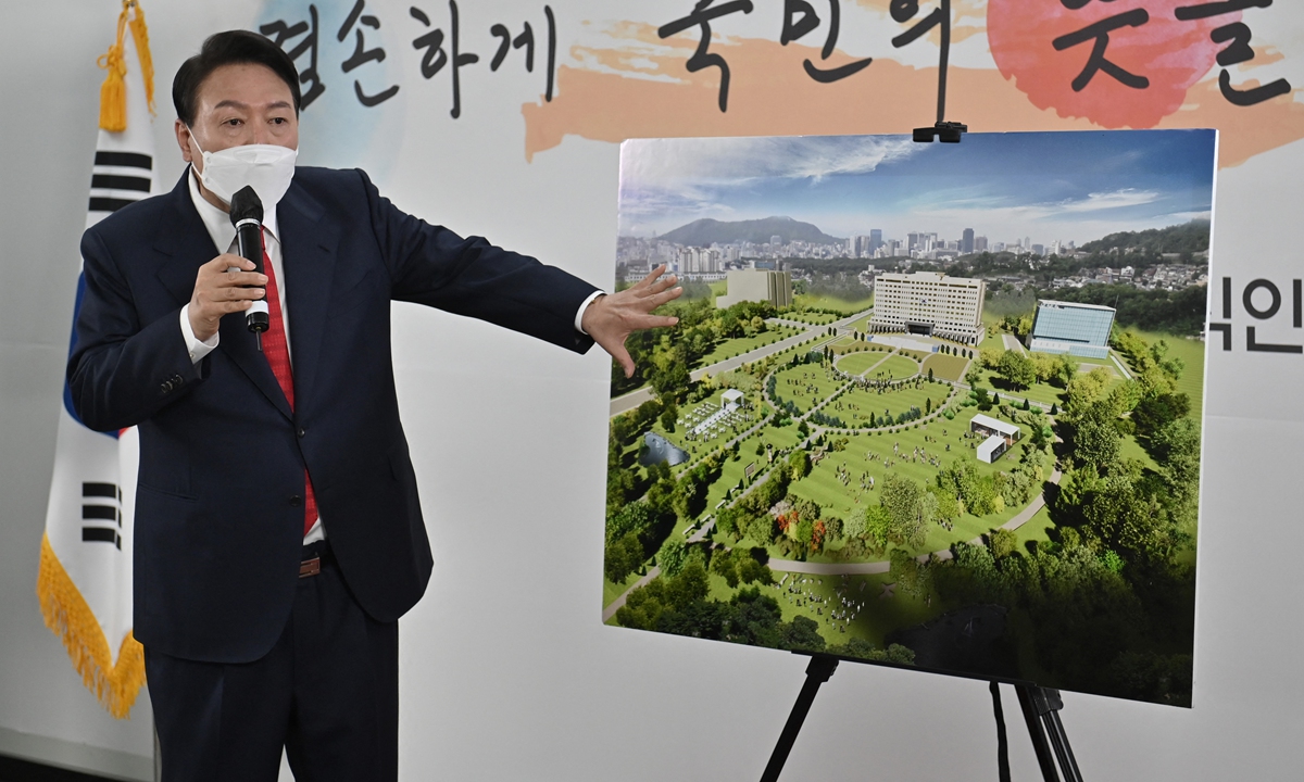 South Korea's president-elect Yoon Suk-yeol shows a bird's-eye view of his planned site of the presidential office during a press conference in Seoul on March 20, 2022. Yoon's plan to break with decades of tradition to move his future office and residence beyond Seoul's Blue House compound has whipped up a fierce debate involving experts in the ancient practice of feng shui, said Reuters. Photo: AFP