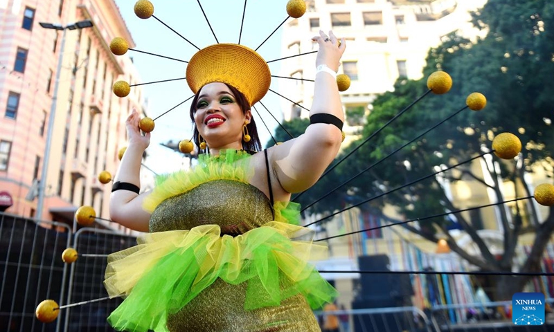 A woman performs during the Cape Town Carnival in Cape Town, South Africa, March 19, 2022. The annual Cape Town Carnival returned to the city Saturday in a new form after a two-year break due to COVID-19, while it maintained a tradition of including performers from the Chinese community and many other groups. (Photo by Xabiso Mkhabela/Xinhua)