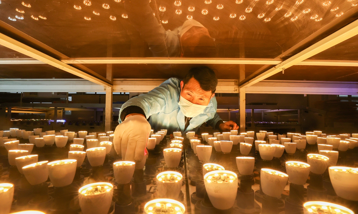 A worker inspects a batch of smart lighting orders at a company in Huzhou, East China's Zhejiang Province on March 21, 2022. Zhejiang Yibo High-Tech Co mainly produces green intelligent lighting products such as LED lamps and intelligent lighting control systems. Its products are exported to more than 40 countries and regions. Photo: cnsphoto