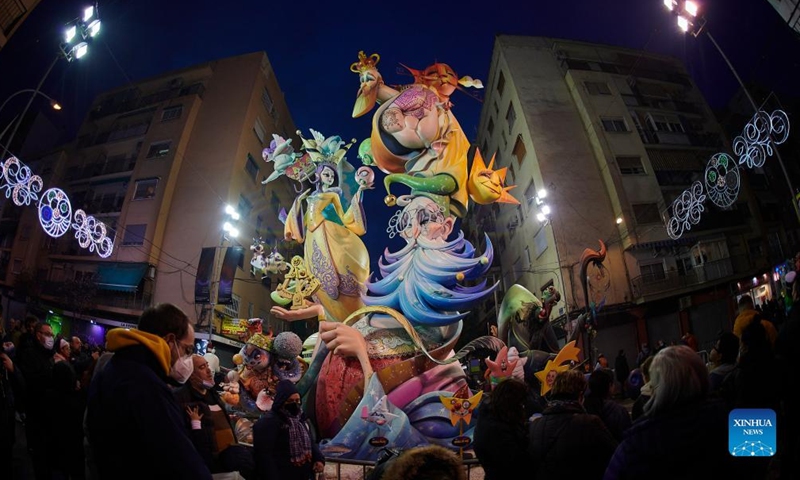 People watch giant dolls during the Fallas Festival celebrations in Valencia, Spain, on March 19, 2022.Photo:Xinhua