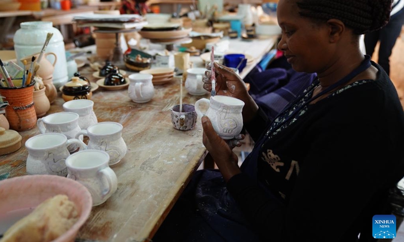 A woman works at the Kazuri workshop in Nairobi, Kenya, on March 21, 2022. Kazuri, Swahili name for small and beautiful, is a famous local brand for hand-made and hand-painted ceramic beads, jewelry and pottery in Kenya. The Kazuri workshop in Kazen has employed over 340 women, mostly single mothers.(Photo: Xinhua)