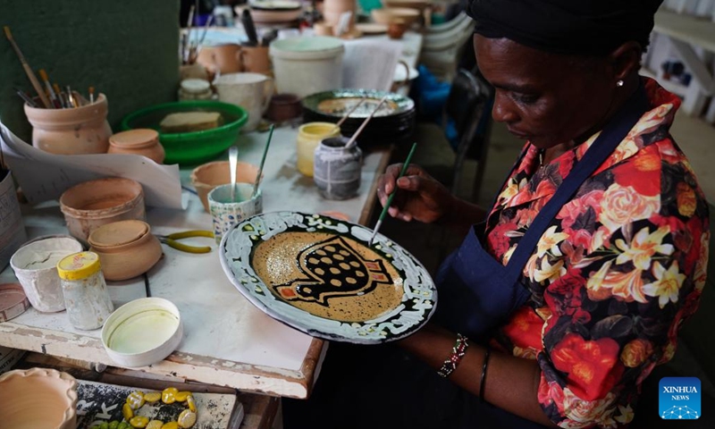 A woman works at the Kazuri workshop in Nairobi, Kenya, on March 21, 2022. Kazuri, Swahili name for small and beautiful, is a famous local brand for hand-made and hand-painted ceramic beads, jewelry and pottery in Kenya. The Kazuri workshop in Kazen has employed over 340 women, mostly single mothers.(Photo: Xinhua)