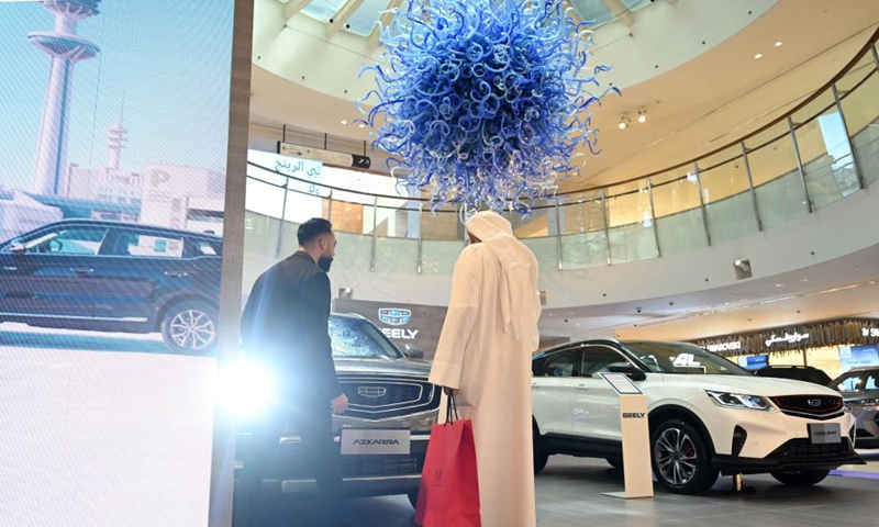 People visit a motor show in Hawalli Governorate, Kuwait, March 23, 2022. The Kuwait Motor Show 2022, which will last until April 1, opened in Hawalli Governorate on Wednesday.(Photo: Xinhua)