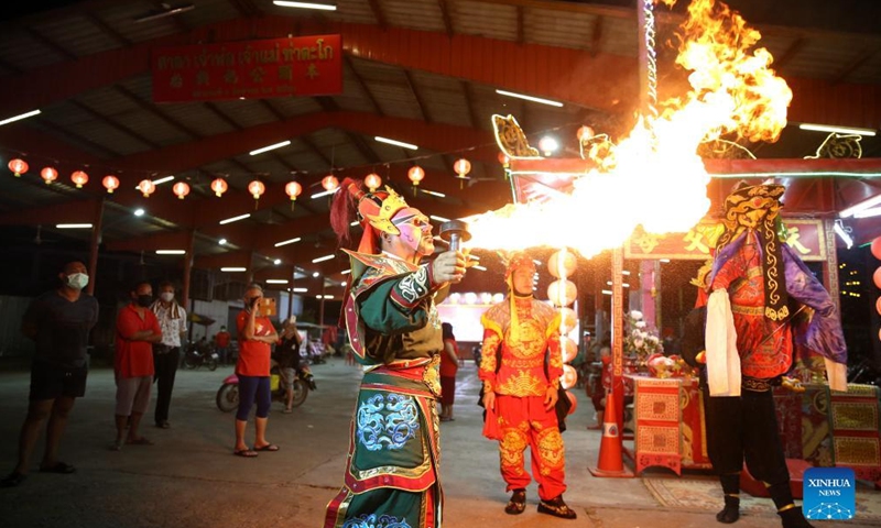 A Chaozhou Opera actor performs fire-breathing in Nakhon Sawan, Thailand, on March 24, 2022. Chinese migrants brought the Chaozhou Opera with them to Thailand more than a hundred years ago. (Photo: Xinhua)