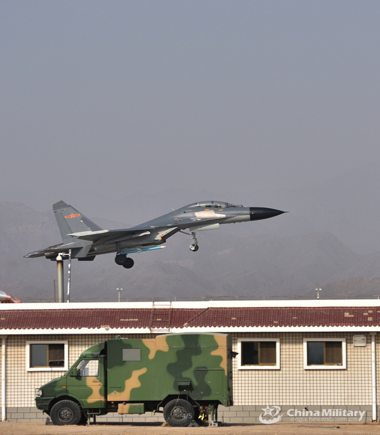 A fighter jet attached to an aviation brigade of the air force under the PLA Western Theater Command takes off for a flight training exercise while passing over the ground station on March 11, 2022. The exercise aimed to boost pilots' ability under emergency situations.  (eng.chinamil.com.cn)