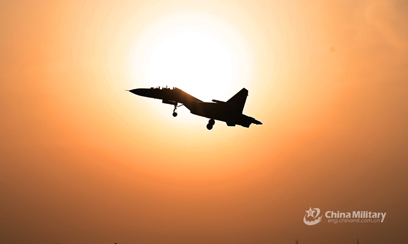 fighter jet attached to an aviation brigade of the air force under the PLA Western Theater Command flies at sunrise during a flight training exercise which aims to boost pilots' ability under emergency situations on March 11, 2022.(eng.chinamil.com.cn)