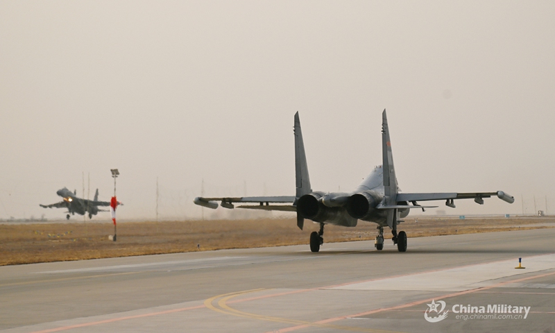 Fighter jets attached to an aviation brigade of the air force under the PLA Western Theater Command taxi on the runway in succession prior to a flight training exercise, which aims to boost pilots' ability under emergency situations on March 11, 2022. (eng.chinamil.com.cn)