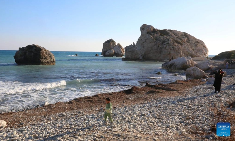 People visit the Petra tou Romiou, also known as Aphrodite's Rock, in Paphos, Cyprus, March 27, 2022.Photo:Xinhua