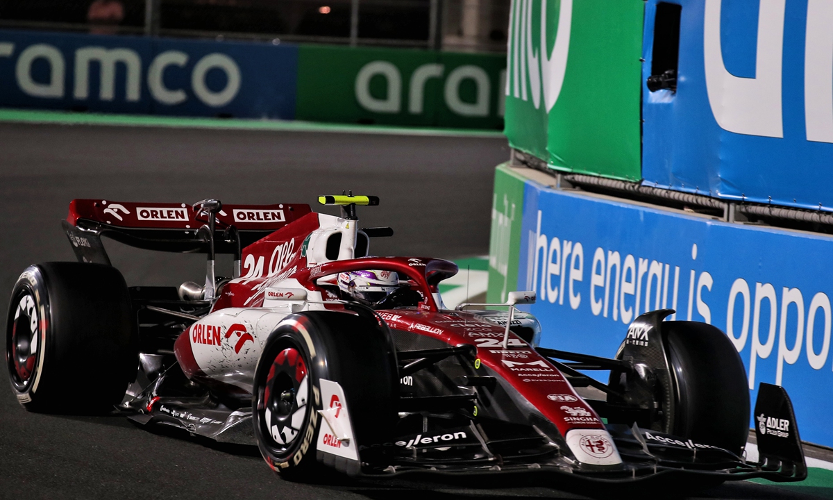 Zhou Guanyu (right) poses for a picture during the Formula 1 STC Saudi Arabian Grand Prix 2022 on March 26, 2022 in Jeddah, Saudi Arabia Photos: IC