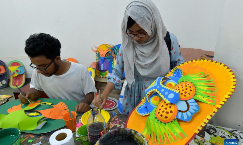 Students make traditional paper works for the Bengali New Year in Dhaka, Bangladesh, April 10, 2022. The Bangla New Year is usually celebrated amid festivities every year on April 14. Photo: Xinhua