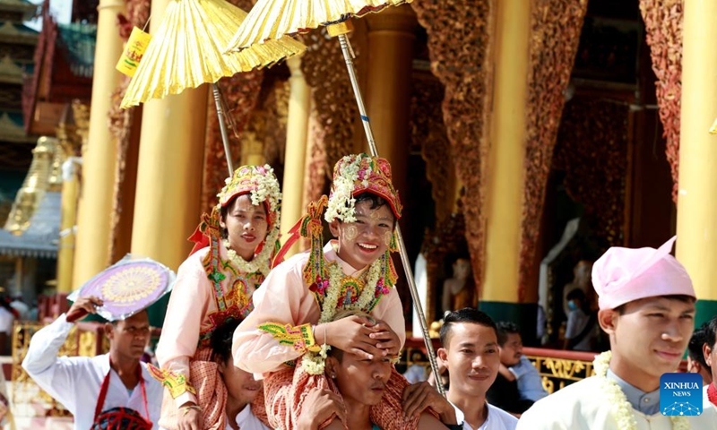 Boys in traditional attire attend the Shinbyu novitiation ceremony at Shwedagon Pagoda in Yangon, Myanmar, April 10, 2022. The Shinbyu novitiation ceremony is an essential part in a life of a male Myanmar Buddhist under the age of 20.Photo:Xinhua