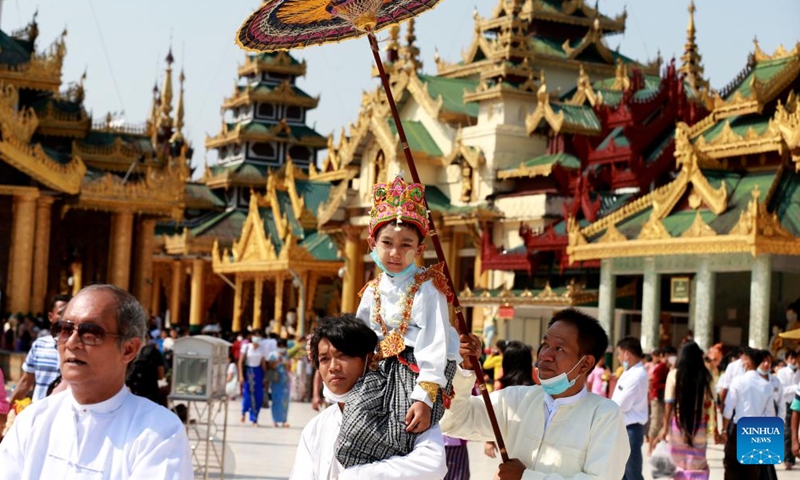 A boy in traditional attire attends the Shinbyu novitiation ceremony at Shwedagon Pagoda in Yangon, Myanmar, April 10, 2022.Photo:Xinhua