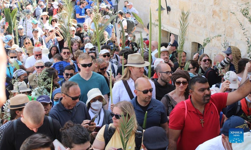 Christians take part in Palm Sunday celebrations in Jerusalem on April 10, 2022.Photo:Xinhua